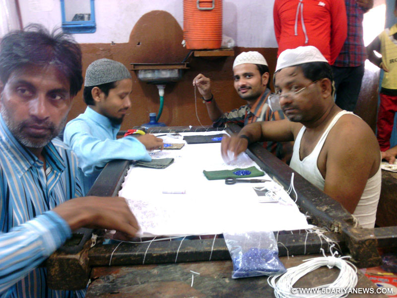 Craftsmen in Mathura creating poshaks for Janamashtmi