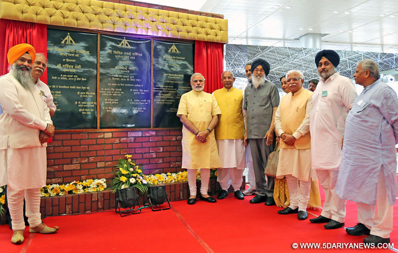 The Prime Minister, Shri Narendra Modi inaugurates the New Civil Air Terminal, at Chandigarh airport, Punjab on September 11, 2015. The Governor of Punjab and Haryana and Administrator, Union Territory, Chandigarh, Prof. Kaptan Singh Solanki, the Chief Minister of Punjab, Shri Prakash Singh Badal, the Chief Minister of Haryana, Shri Manohar Lal Khattar, the Union Minister for Civil Aviation, Shri Ashok Gajapathi Raju Pusapati and other dignitaries are also seen.