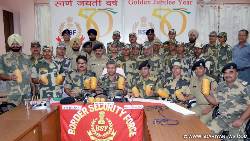 BSF officials present before press 14 kg heroin worth Rs 70 crores in international market in Ferozepur, Punjab on Sep 13, 2015. 