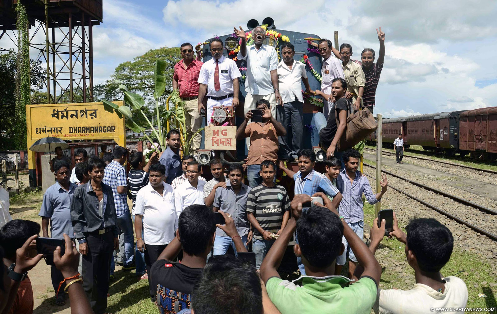 People enjoying the last meter gauge train from Dharmanagar in North Tripura to Agartala on Sep 19, 2015. The metre-gauge tracks laid in Tripura are to be pulled up to make way for broad gauge tracks.