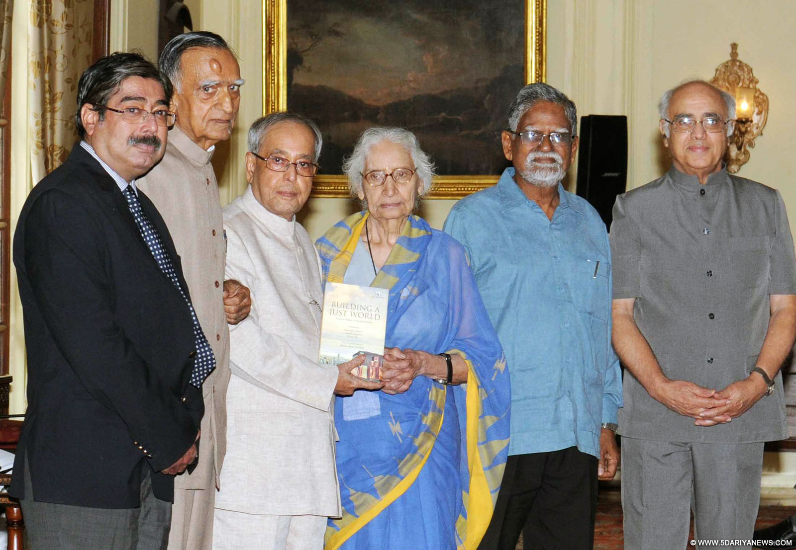 The President, Pranab Mukherjee receiving the first copy of the book ‘Building A Just World Essays in honour of Muchkund Dubey’, at Rashtrapati Bhavan, in New Delhi on September 21, 2015.