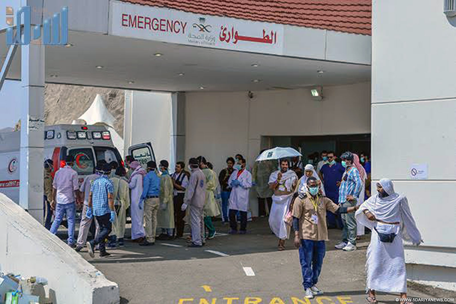 Health workers help the injured near the Saudi Arabia