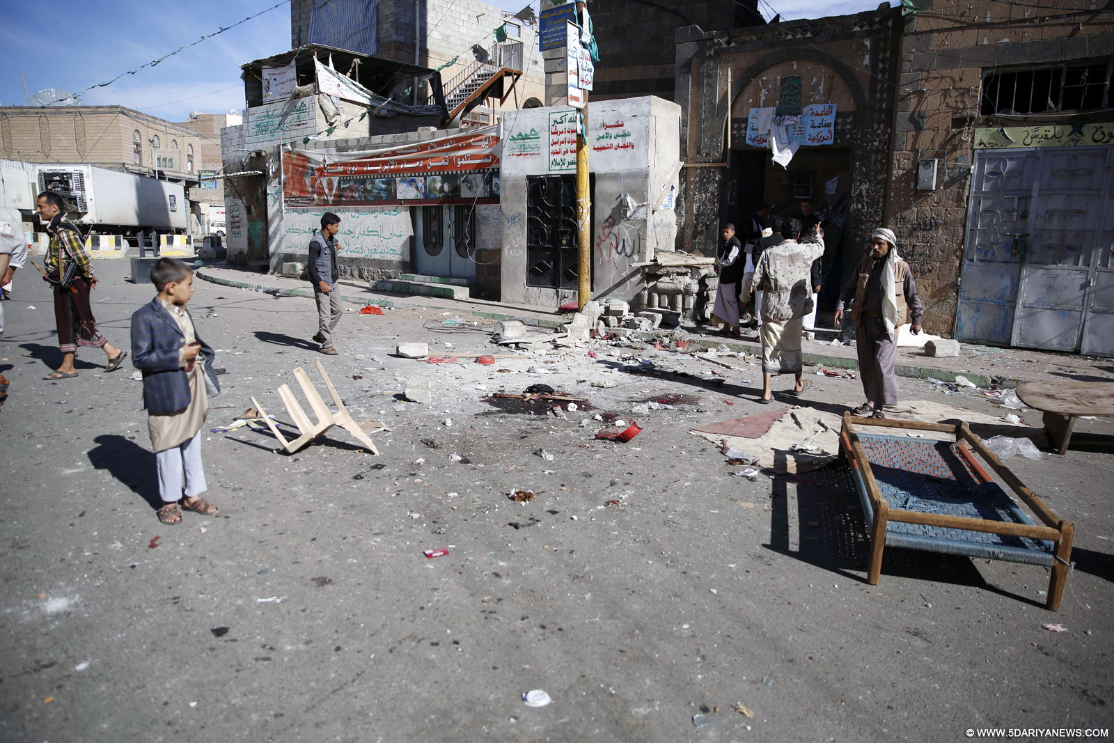  People gather around the mosque hit by suicide bombing attack in Sanaa, Yemen, on Sept. 24, 2015. Two suicide bombings rocked a mosque during Eid al-Adha prayers in Sanaa on Wednesday morning, killing about 30 people and injuring scores of others, a security official told Xinhua. 