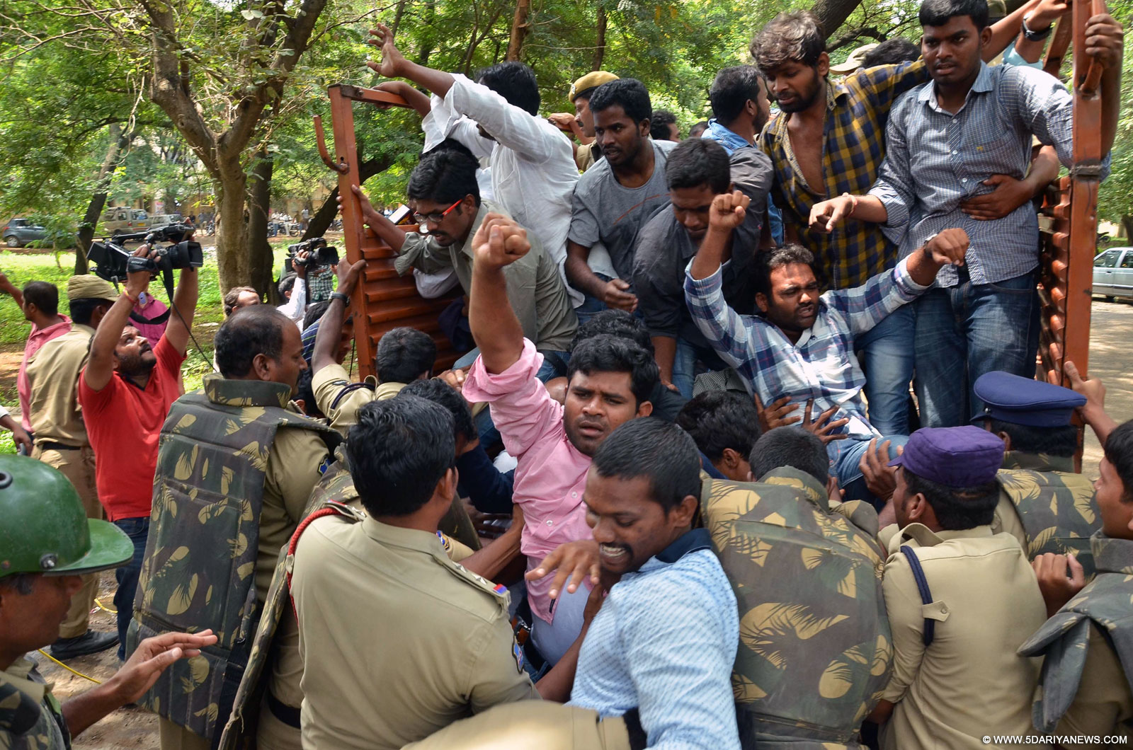 Hyderabad: Police take away Osmania University students stage a demonstration to protest against the killing of two Maoists by police in Hyderabad, on Sep 30, 2015. 