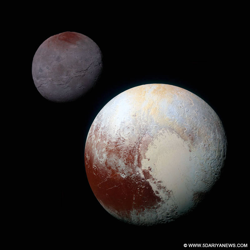 This composite of enhanced colour images of Pluto (lower right) and Charon (upper left) was taken by the New Horizons spacecraft.