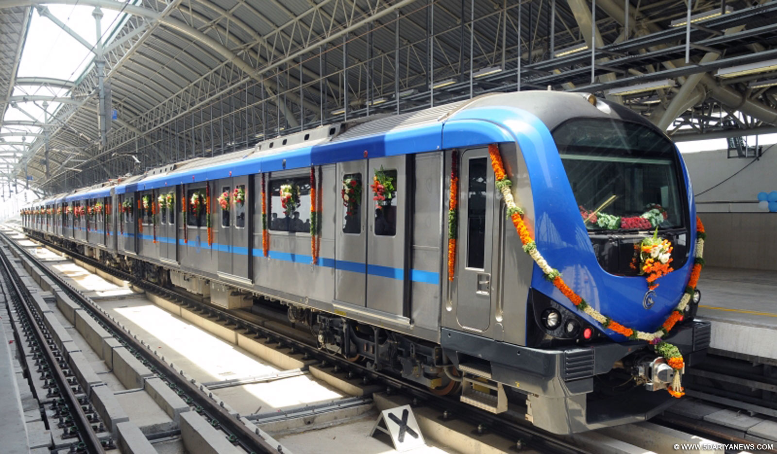 The picture shows a newly inaugurated metro rail coach plying through in Chennai, Tamil Nadu.