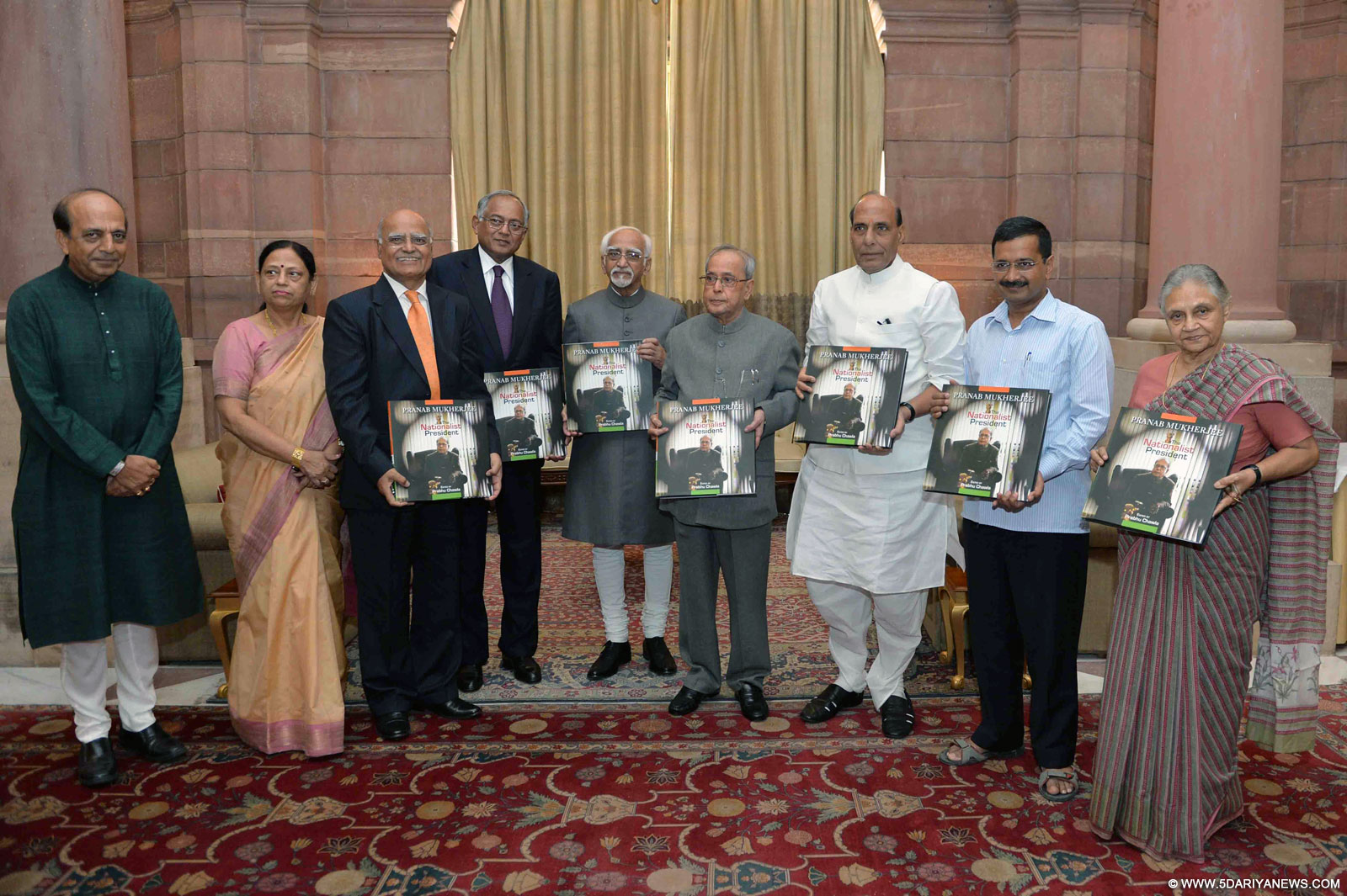President Pranab Mukherjee with Vice-President Mohammad Hamid Ansari, Union Home Minister Rajnath Singh, Delhi chief Minister Arvind Kejriwal, Former Kerala Governor Sheila Dikshit, journalist Prabhu Chawla, and other dignitaries during a programme organised to receive the first copy of Chawla