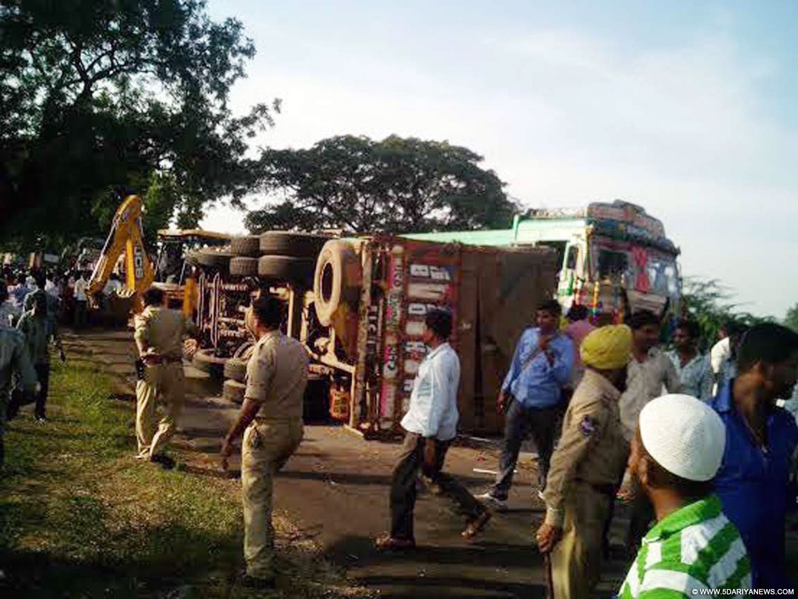 Mangled remains of the bus that collided with a truck in Telangana
