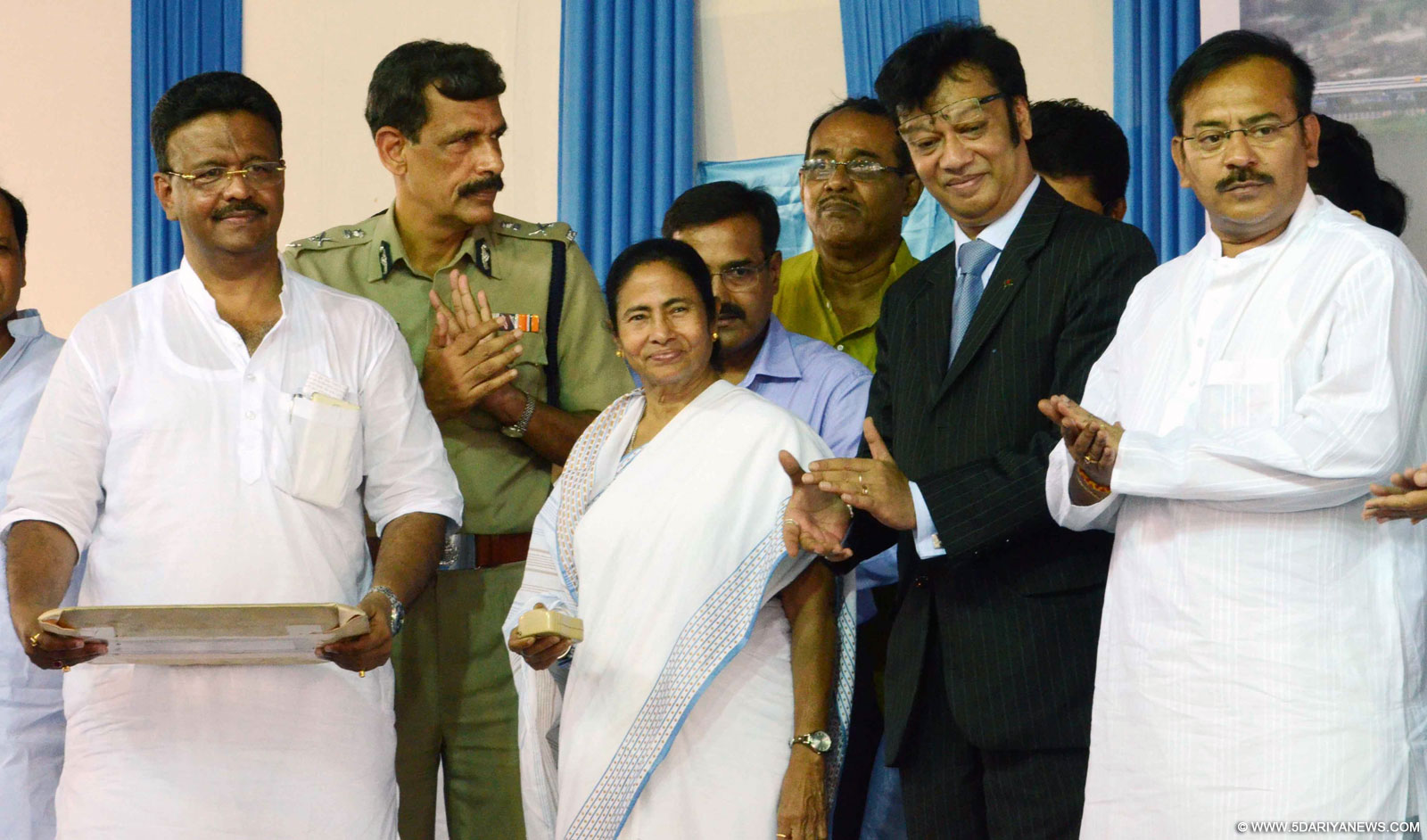 West Bengal Chief minister Mamata Banerjee during the inauguration of new Parama Flyover at EM Bypas in Kolkata on Oct 9, 2015. Also seen Kolkata Commissioner of Police Surajit Kar Purkayastha with others minister and official. 