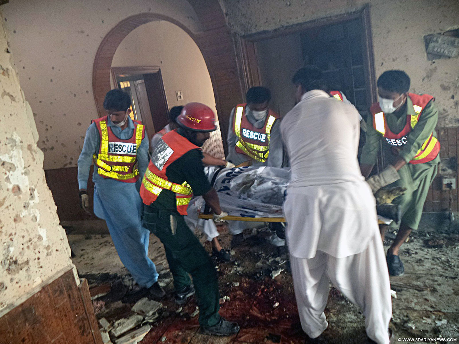 Rescuers work at the blast site in central Pakistan