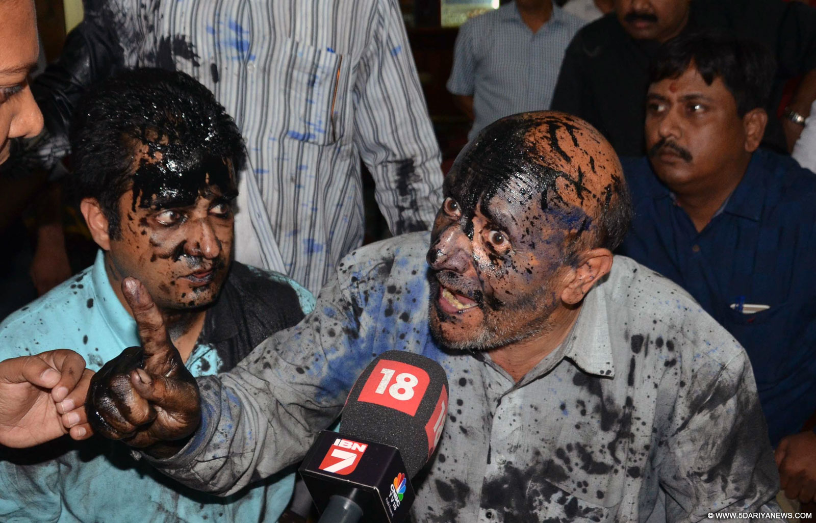 Ink smeared face of Jammu and Kashmir Lawmaker Sheikh Abdul Rashid during a press conference at Press Club in New Delhi, on Oct 19, 2015.