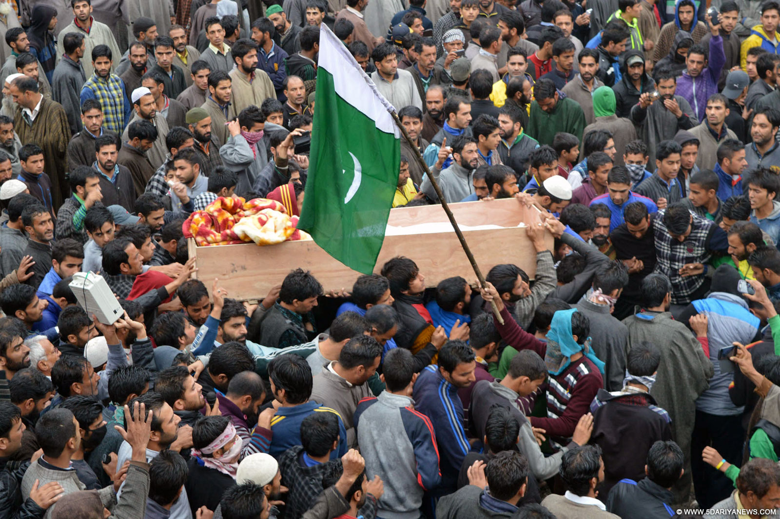 People in large numbers participate in the funeral of Zahid Ahmad succumbed to his injuries in Botengo, Anantnag district of Jammu and Kashmir on Oct 19, 2015. 