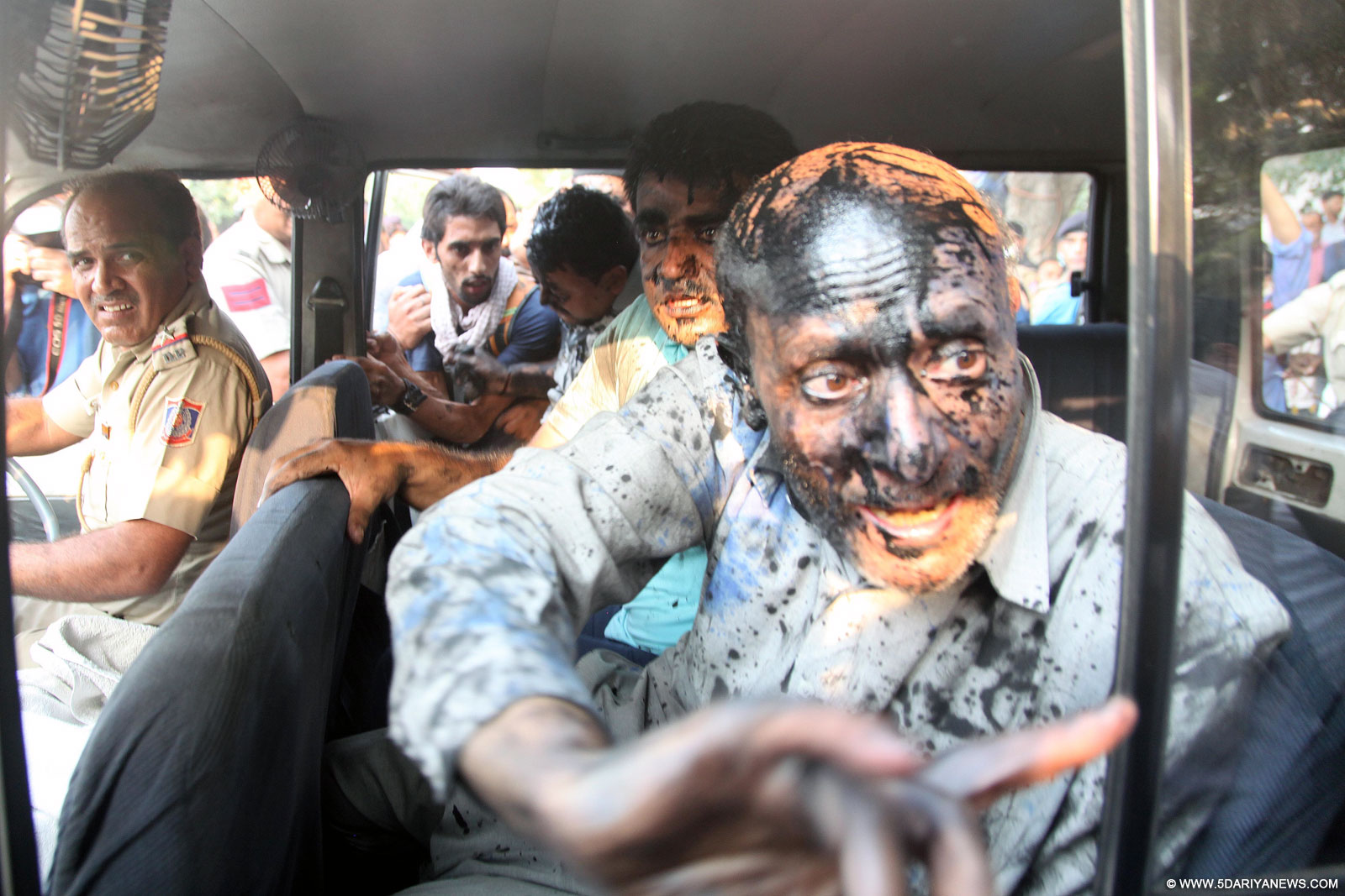 Ink smeared face of Jammu and Kashmir Lawmaker Sheikh Abdul Rashid at Press Club in New Delhi, on Oct 19, 2015.