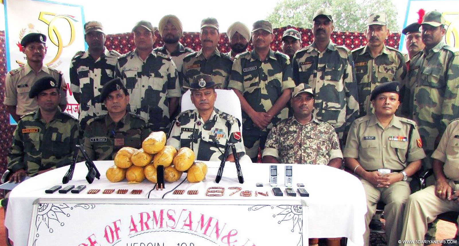 BSF officials display 10 kg heroin and arms and ammunition seized near Border Out Post Dharma, Ferozepur on Oct 19, 2015. 