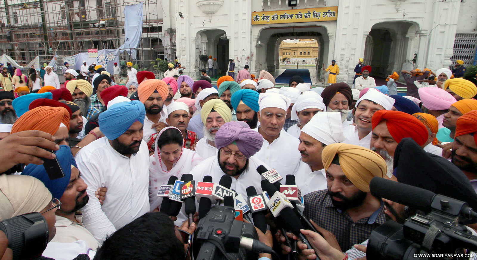Congress leader Captain Amarinder Singh talks to press outside the Golden Temple in Amritsar, on Oct 19, 2015. 