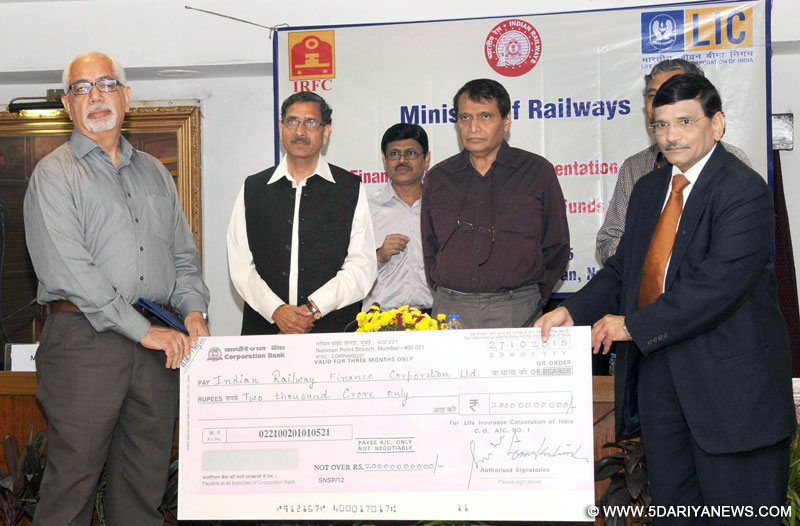 The Union Minister for Railways, Shri Suresh Prabhakar Prabhu witnessing the handing over the first cheque of Rs. 2000 crore by the Life Insurance Corporation (LIC) to the Railway PSU Indian Railway Finance Corporation (IRFC) towards financial assistance to Railways, in New Delhi on October 27, 2015. The Chairman, Railway Board, Shri A.K. Mital is also seen. 