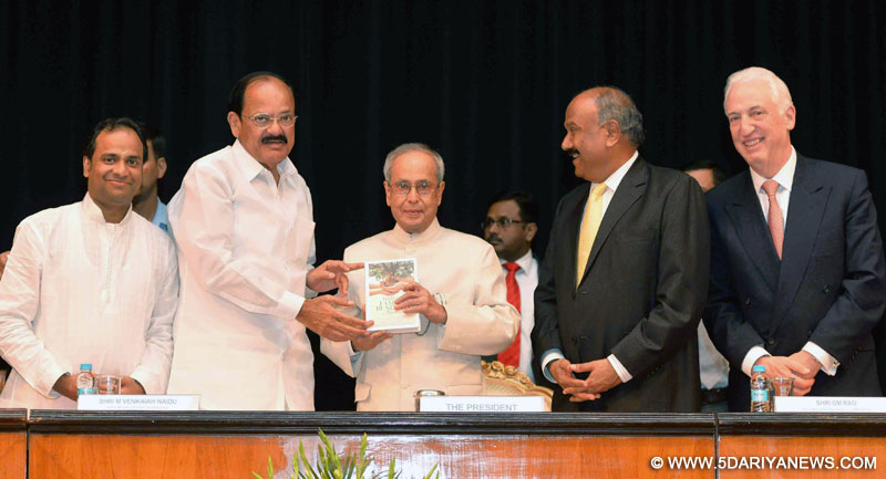 The President, Shri Pranab Mukherjee receiving the first copy of the book 