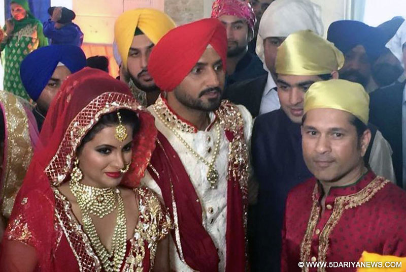 Indian cricketer Harbhajan Singh and his wife Geeta Basra during their marriage ceremony in Jalandhar, on Oct 29, 2015.Also seen cricket legend Sachin Tendulkar.