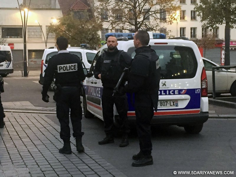 French policemen block roads near the area of an anti-terrorist police assault in northern Paris suburbs Saint-Denis, France, on Nov. 18, 2015.