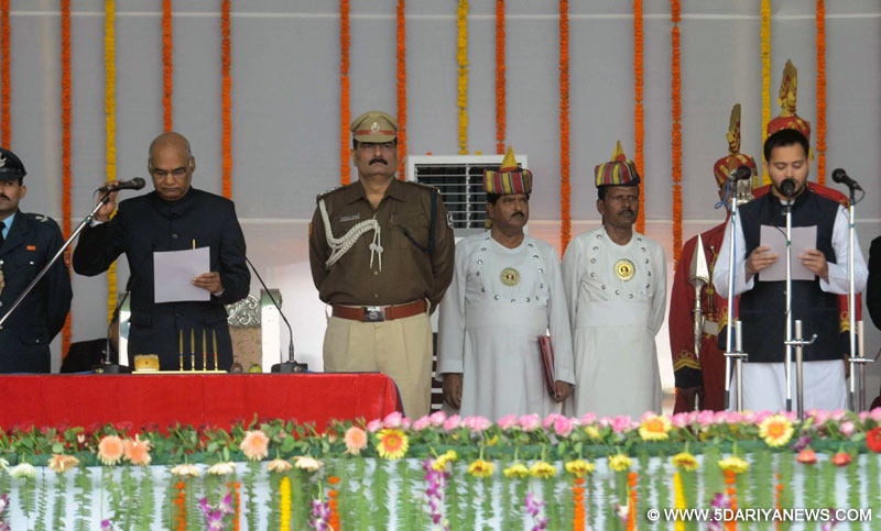Tejashwi Yadav takes oath as a cabinet minister during the swearing-in ceremony of the new JD-U-RJD-Congress coalition government in Patna, on Nov 20, 2015. 