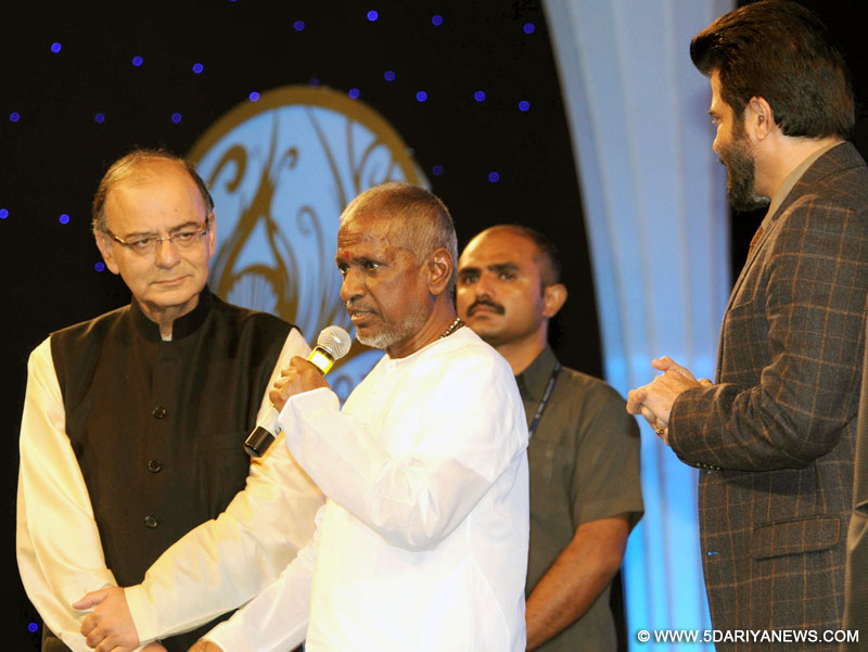 Music Maestro Ilayaraja speaking after receiving the centenary award at the inauguration of the 46th International Film Festival of India (IFFI-2015), in Panaji, Goa on November 20, 2015. The Union Minister for Finance, Corporate Affairs and Information & Broadcasting, Shri Arun Jaitley and the Chief Guest Actor Anil Kapoor are also seen. 