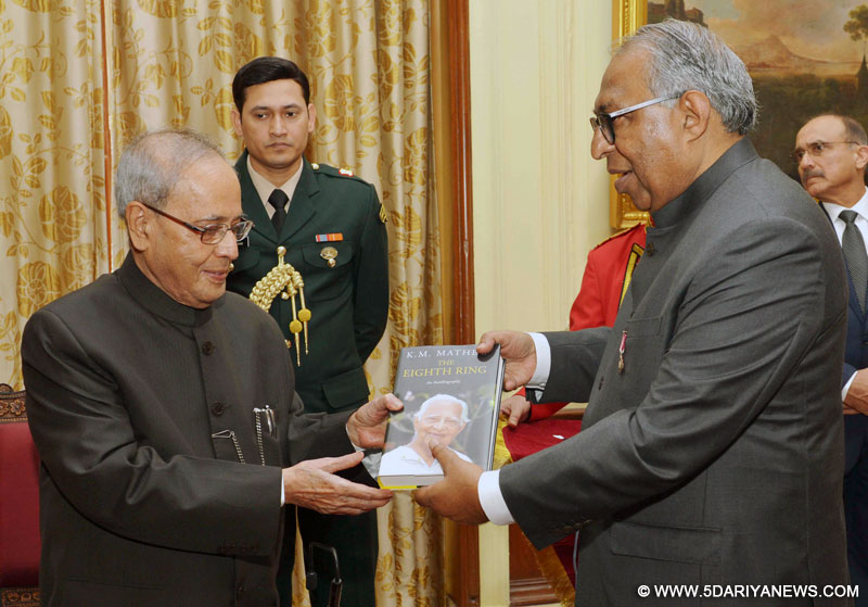 The President, Shri Pranab Mukherjee receiving the first copy of the book entitled "8th Ring" from the Chief Editor, Malayala Manorama, Shri Mammen Mathew, at Rashtrapati Bhavan, in New Delhi on November 26, 2015.