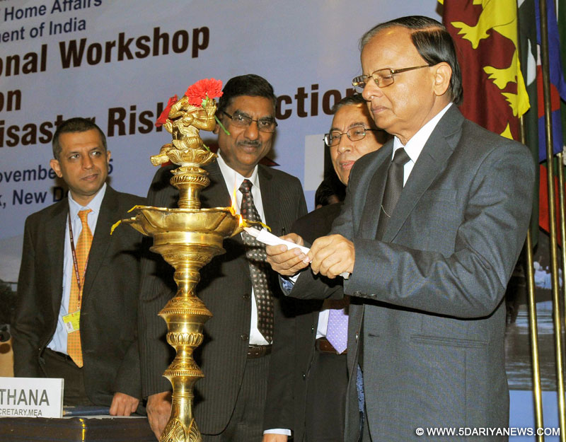 The Additional Principal Secretary to the Prime Minister of India, Dr. P.K. Mishra lighting the lamp to inaugurate the SAARC Regional Workshop on Sharing of Best Practices on Disaster Risk Reduction (DRR), in New Delhi on November 27, 2015.