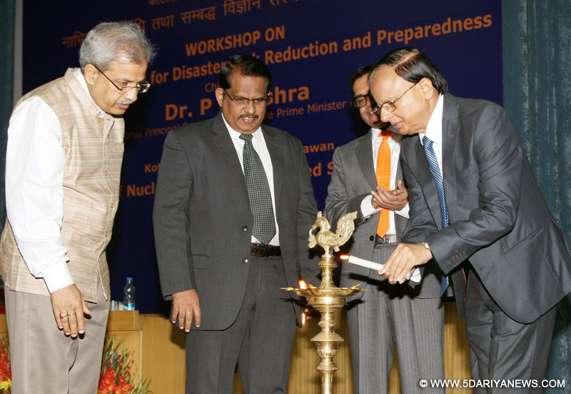 The Additional Principal Secretary to the Prime Minister of India, Dr. P.K. Mishra lighting the lamp to inaugurate the Workshop on DRDO Technologies for Disaster Risk Reduction and Preparedness, in New Delhi on November 28, 2015. The Secretary, Department of Defence R&D and Director General, DRDO, Dr. S. Christopher, the DS & DG (LS), Dr. Manas K. Mandal and the Director, INMAS, Dr. A.K. Singh are also seen.