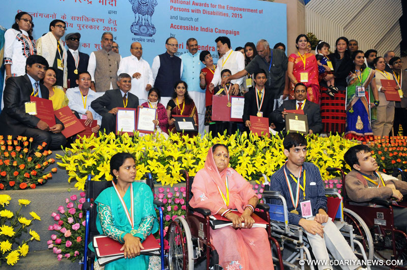 The Minister of State for Information & Broadcasting, Col. Rajyavardhan Singh Rathore presenting an award at the closing ceremony of the 1st International Film Festival for Persons with Disabilities, in New Delhi on December 03, 2015. The Minister of State for Social Justice & Empowerment, Shri Vijay Sampla and actor Vivek Oberoi are also seen. 