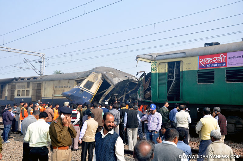 The mangled bogies of an EMU (electric multiple unit) shuttle train and an express train that collided head on near village Baghola in Palwal district of Haryana, about 80 km from New Delhi on Dec 8, 2015. Nearly 100 people were injured in the accident.