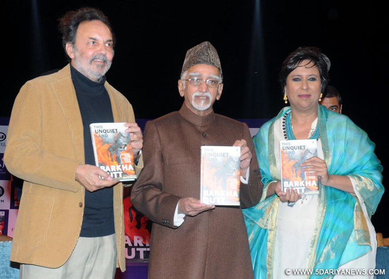 The Vice President, Shri Mohd. Hamid Ansari releasing the book titled “This Unquiet Land: Stories from India