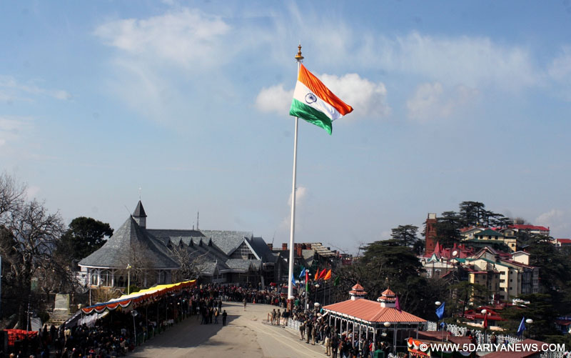 Shimla: Himachal Pradesh Chief Minister Virbhadra Singh hoists a 100 feet high National Flag in Shimla, on Dec 17, 2015. 