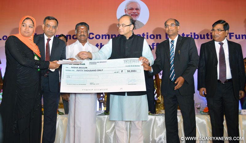 Arun Jaitley distributing loans to those affected in the recent floods, during the Loans and Insurance Compensation Distribution Function for those affected by the recent Floods, in Chennai on December 20, 2015. 
