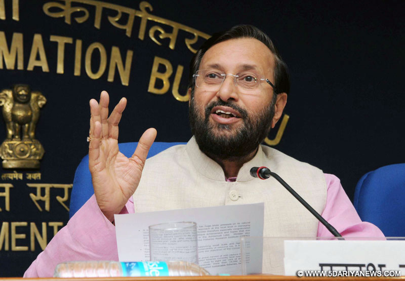 Prakash Javadekar addressing the press conference, in New Delhi on December 16, 2015. The Secretary, Ministry of Environment, Forest and Climate Change, Shri Ashok Lavasa and other dignitaries are also seen.