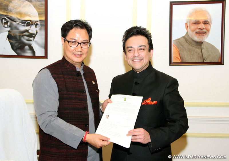 New Delhi: Union Minister of State for Home Affairs Kiren Rijiju presents the Certificate of Indian Citizenship by Naturalization to noted singer and musician Adnan Sami, in New Delhi on Jan 1, 2016.