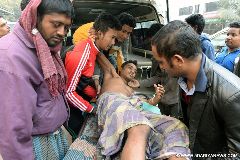  University students transfer an earthquake survivor to a hospital in Dhaka, Bangladesh, Jan. 4, 2015. At least two people in the Bangladeshi capital died when a massive earthquake jolted neighboring India early Monday morning, sources said. Some 100 people have also reportedly been injured as many with panic rushed out of their residences for safety. 