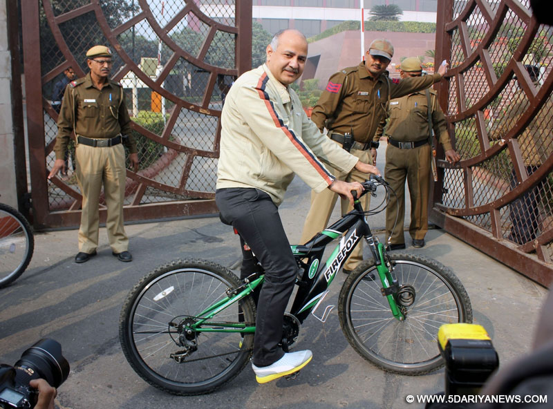 Delhi Deputy Chief Minister Manish Sisodia arrives at Delhi Secretariat riding a cycle on Jan 4, 2016. 