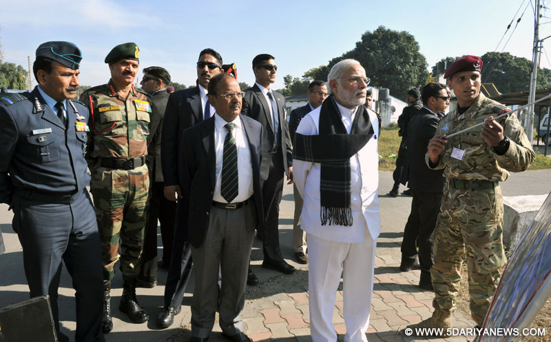 The Prime Minister, Shri Narendra Modi being given a presentation on counter-terrorist and combing operation by the Defence Forces, at Pathankot Airbase on January 09, 2016. The Chief of Army Staff, General Dalbir Singh is also seen.
