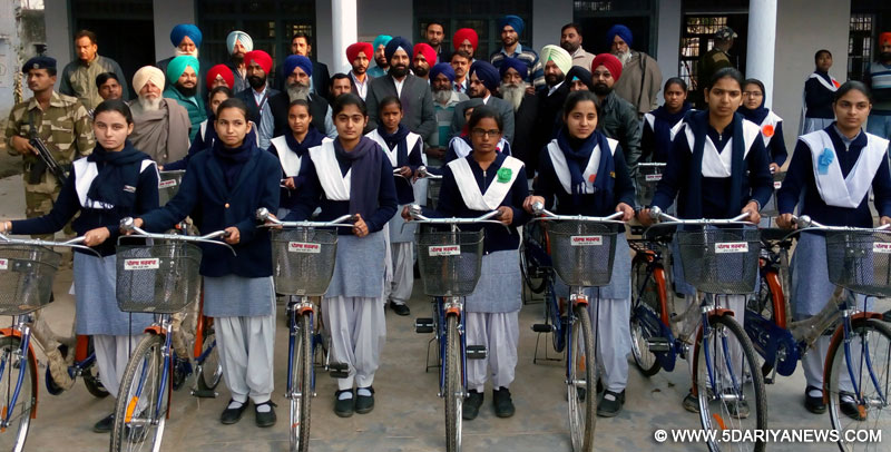 Punjab Revenue Minister Bikram Singh Majithia distributing cycles to girl students of Class XI and XII at Government Senior Secondary School, Kathunangal.