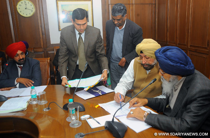 Punjab Chief Minister Mr. Parkash Singh Badal monitoring the flood protection works in the state with all the Deputy Commissioners during a meeting held at Punjab Bhawan on Thursday.