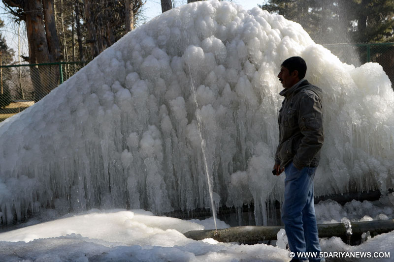 Icicles formed after leaked water pipe cause water overflow at Tangmarg in Baramulla district of Jammu and Kashmir.