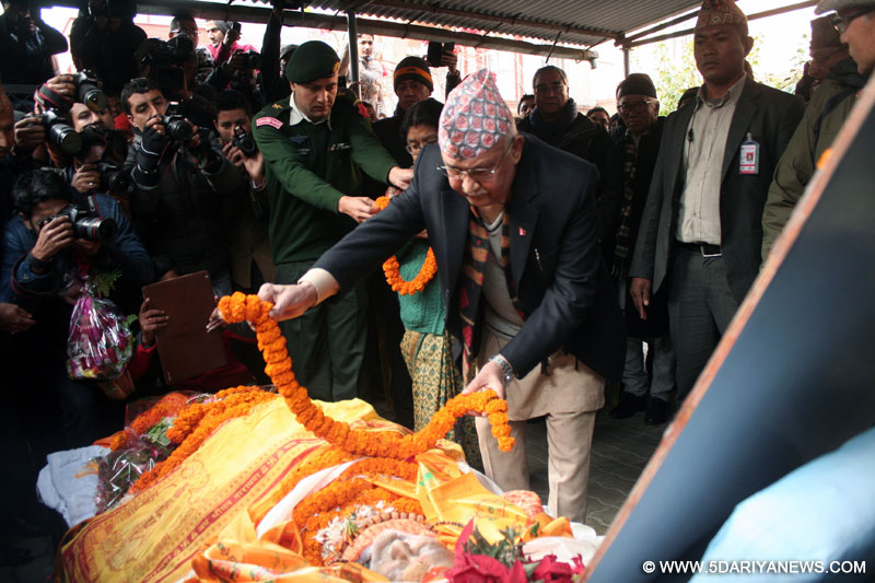Nepalese Prime Minister Khadga Prasad Sharma Oli (C) pays last tribute to former prime minister Sushil Koirala in Kathmandu, Nepal, Feb. 9, 2016. 