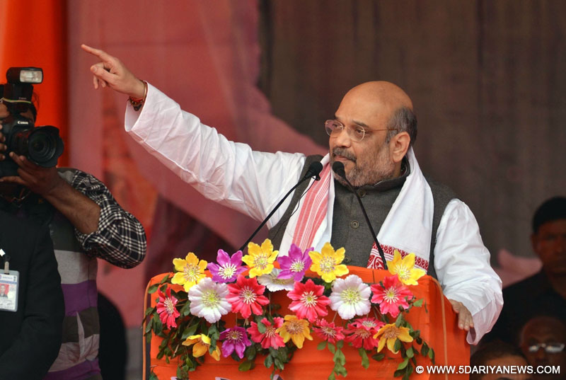 BJP president Amit Shah addresses during a booth-level party workers rally in Nagaon district of Assam, on Feb 10, 2016.