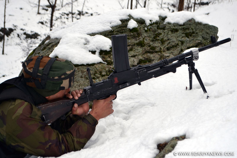 A soldier take position during an encounter with militants in Kupwara district of Jammu and Kashmir on Feb 12, 2016.