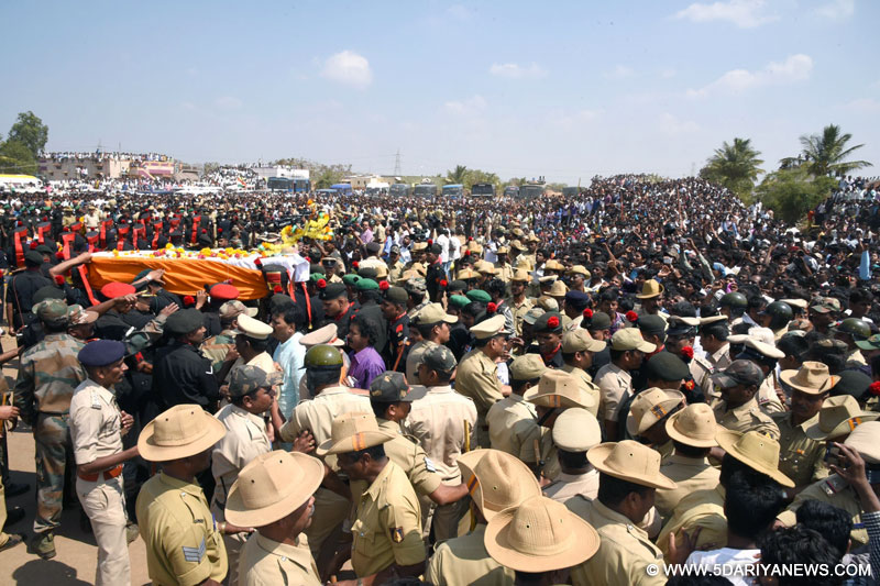 The mortal remains of Lance Naik Hanamanthappa Koppad being brought up at the cremation ground in Betadoor village in Hubli, Karnataka, on Feb 12, 2016.