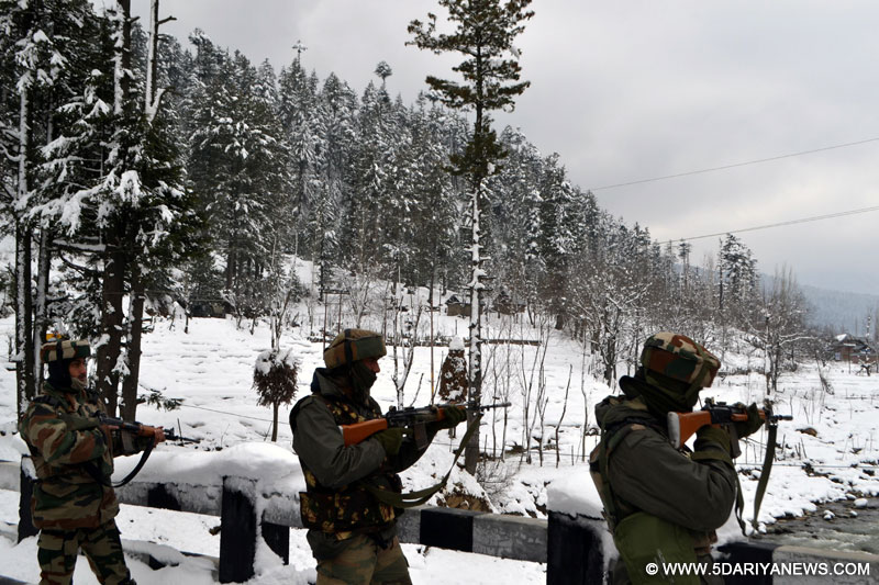 A soldier take position during an encounter with militants in Kupwara district of Jammu and Kashmir on Feb 12, 2016.