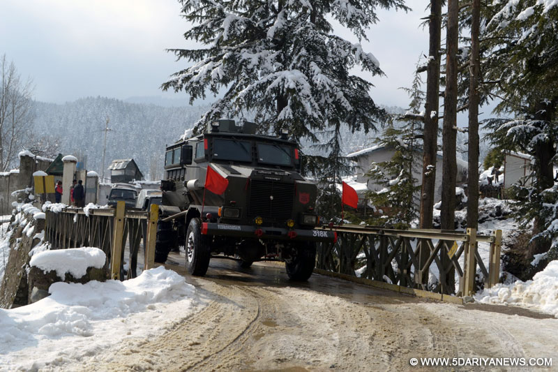 Army vehicles heading towards encounter site at Kupwara in Jammu and Kashmir on Feb. 13, 2016.