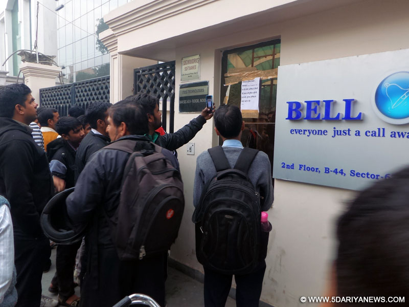 People throng the office of Ringing Bell to buy its newly launched "Freedom 251" smartphone