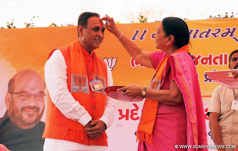 Gujarat Chief Minister Anandiben Patel greets newly elected state BJP president Vijay Rupani in Gandhinagar, on Feb 19, 2016.