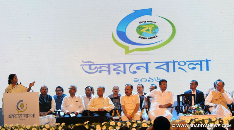 West Bengal Chief Minister Mamata Banerjee addresses during the inauguration of `Unnayane Bangla 2016` in Kolkata on Feb 26, 2016. Also West Bengal Finance Minister Amit Mitra. 